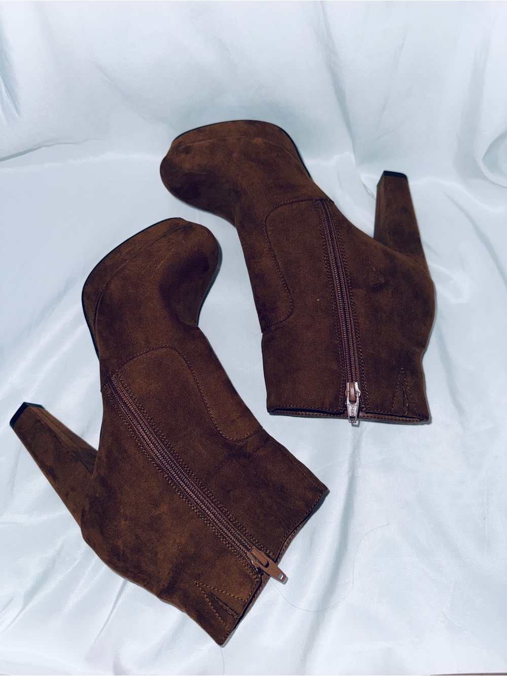 Woman’s brown ankle zip up heeled boots